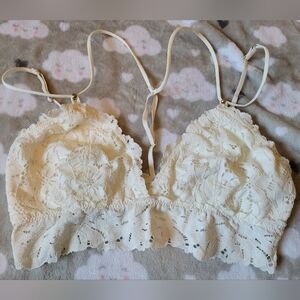 Aerie off white lacey/strappy bralette sizeM
